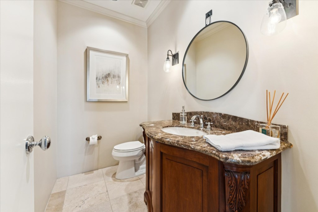 Elegant bathroom with marble countertops and modern fixtures.