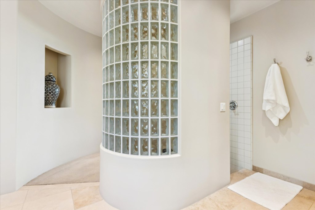 Modern bathroom with glass block shower and chic minimalistic design.