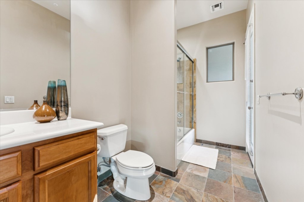 Modern bathroom with glass shower and elegant tiling, perfect for relaxing.