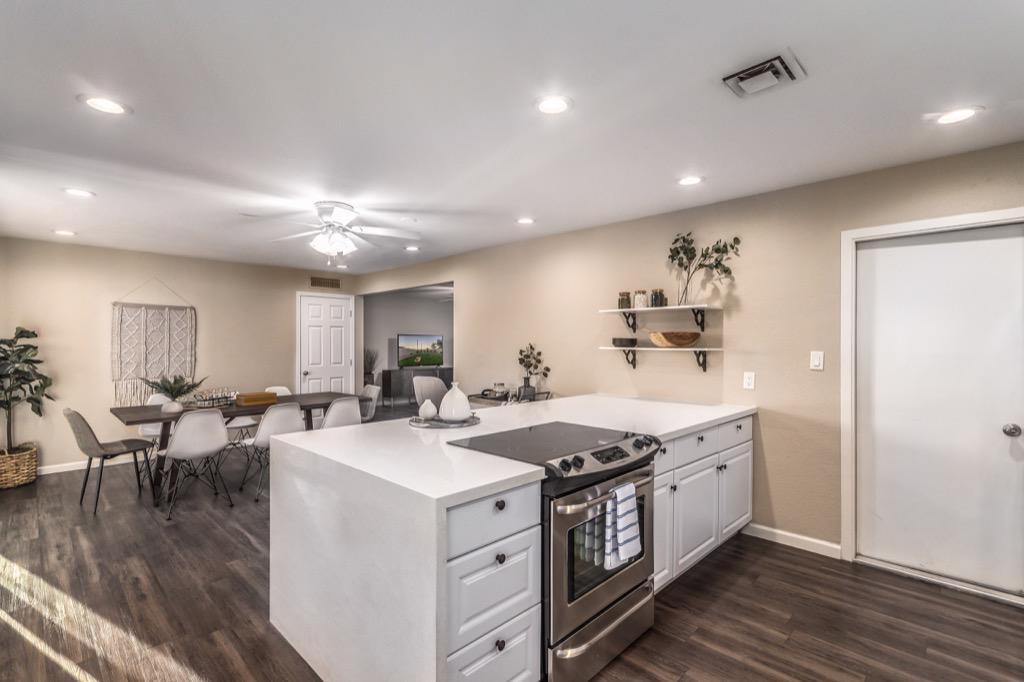Sleek modern kitchen with large island, ideal for casual dining and entertaining.