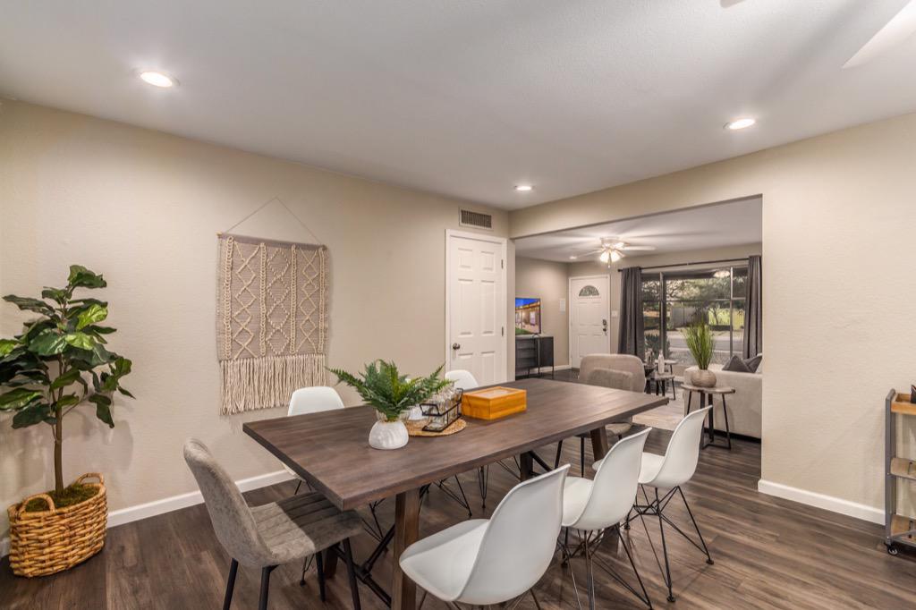 Modern dining area with a large table, ideal for family dinners or entertaining guests.