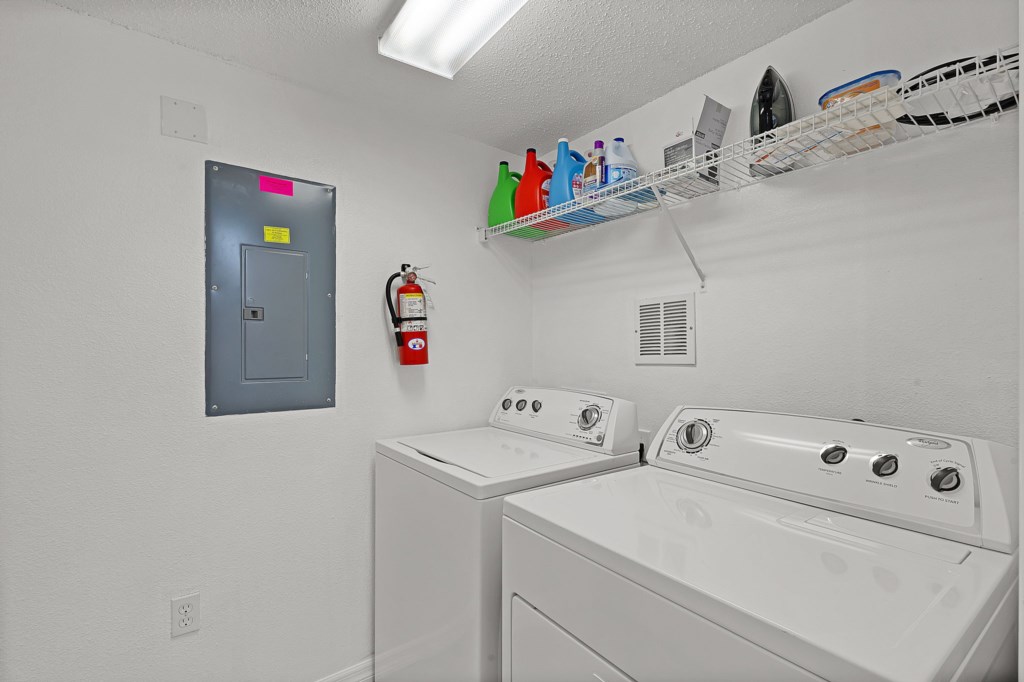 Convenient closet with washer, dryer, and detergent for your laundry needs.