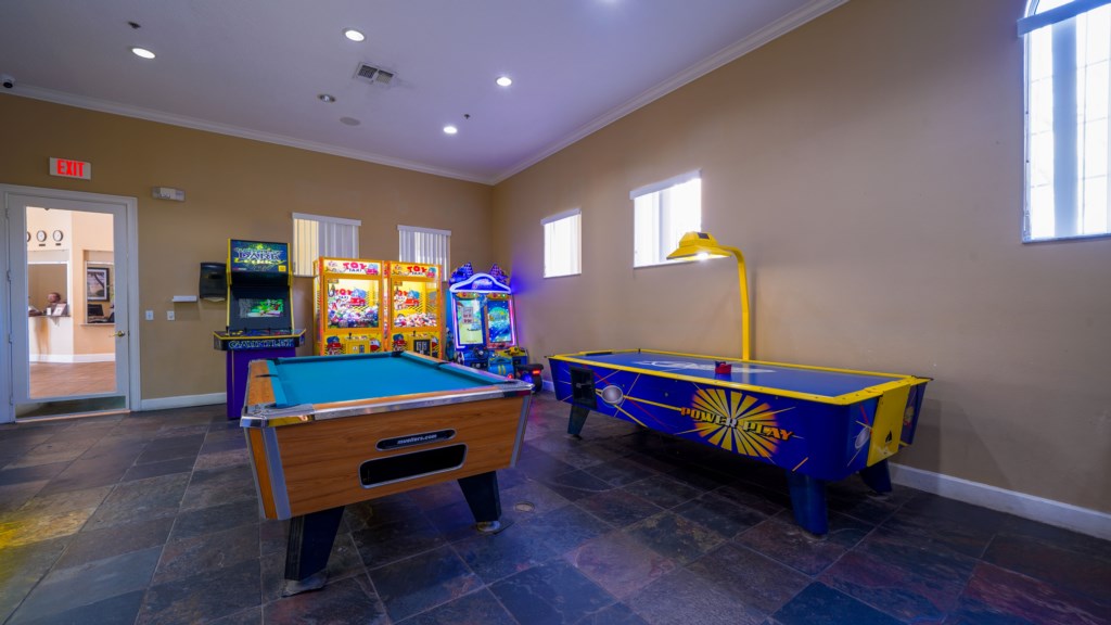 Entertainment room featuring a full-size pool table and arcade machine.