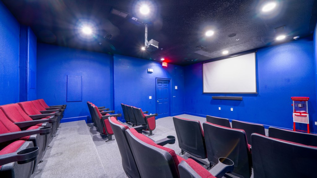 Cinema-style space with plush seating and large screen for the ultimate movie experience.