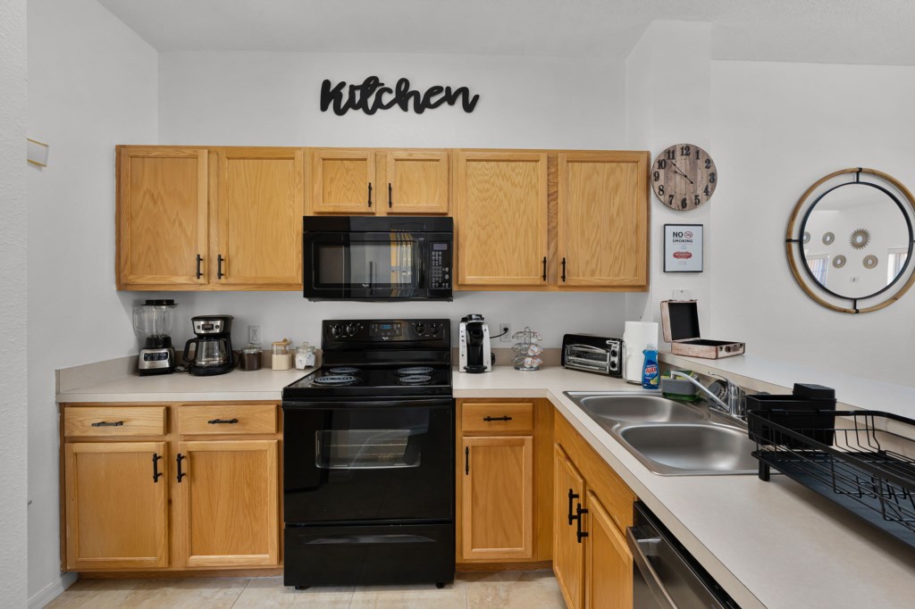 Fully equipped kitchen with modern appliances and ample counter space.