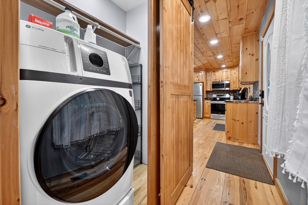 Convenient in-unit laundry with a view through to the kitchen.
