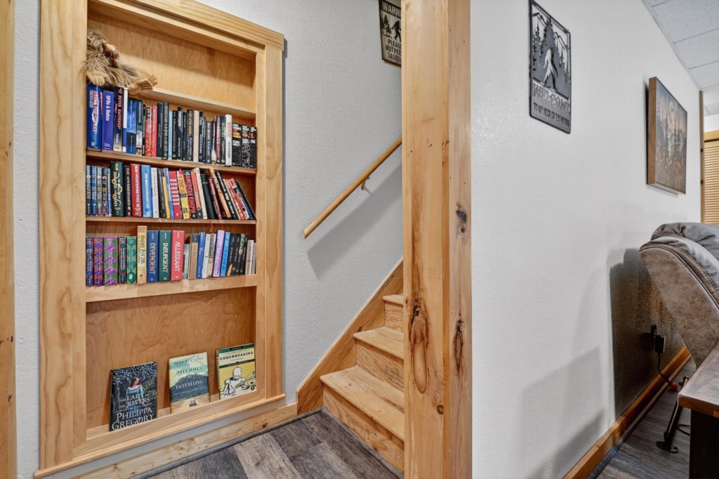 Cozy reading nook with a well-stocked bookshelf, ideal for book lovers.