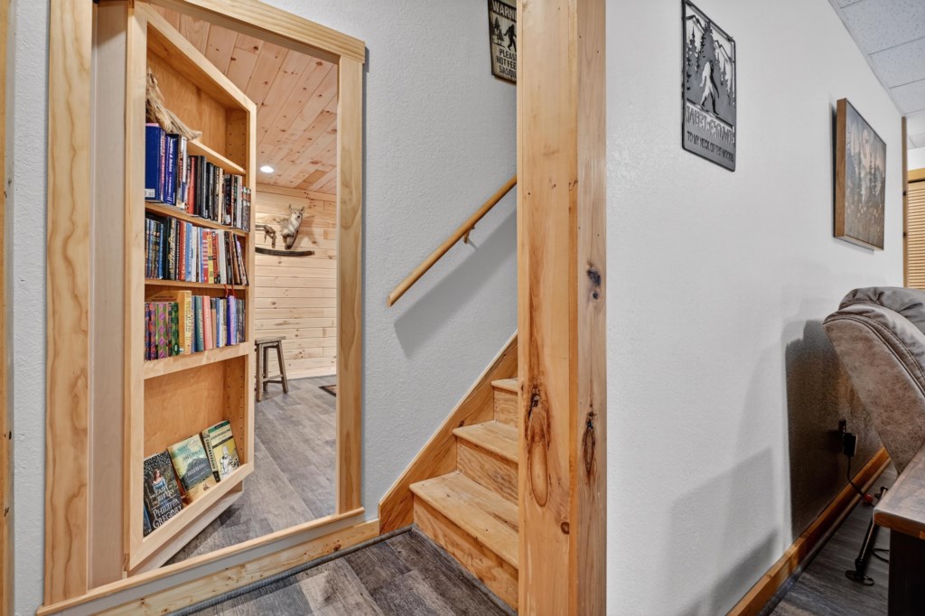 Cozy reading nook with a well-stocked bookshelf and comfortable seating.
