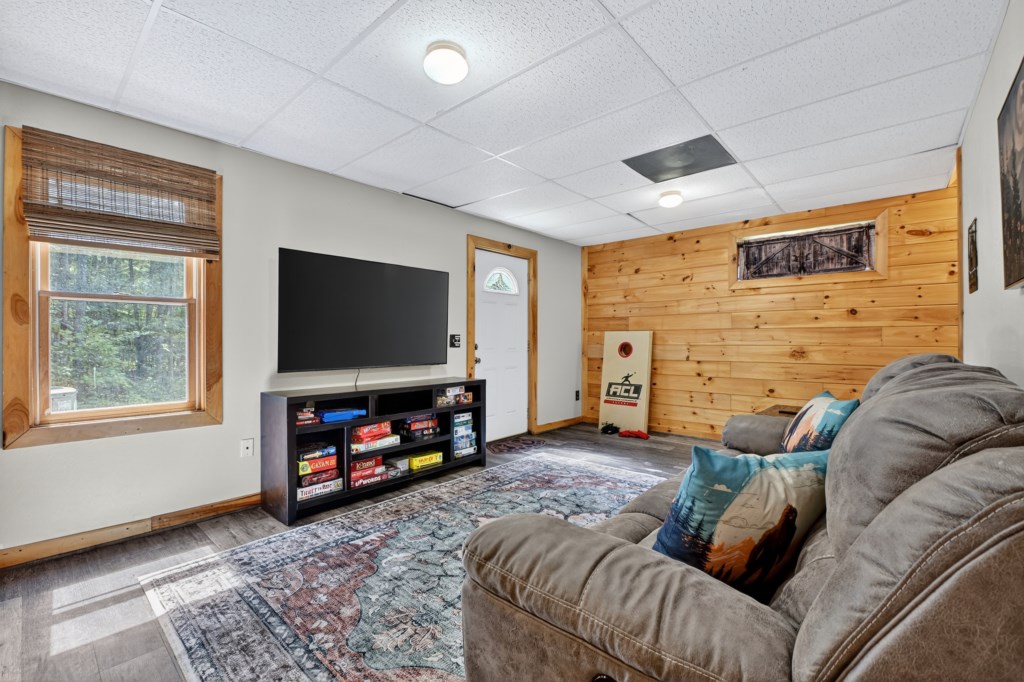 Cozy living area with plush seating and a flat-screen TV, ideal for movie nights.