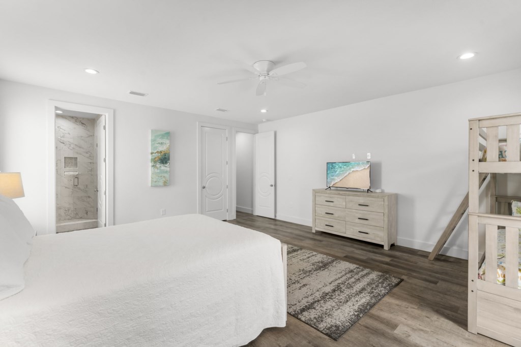 Guest Bedroom With Queen Bed, Three Twin Beds, and Private Bathroom On 2nd Floor