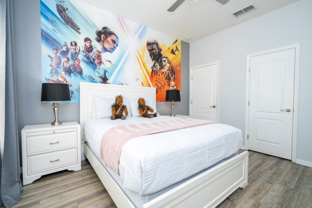 1st floor bedroom w/ queen bed and flat screen TV