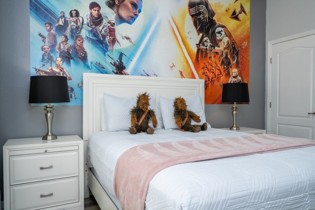 1st floor bedroom w/ queen bed and flat screen TV