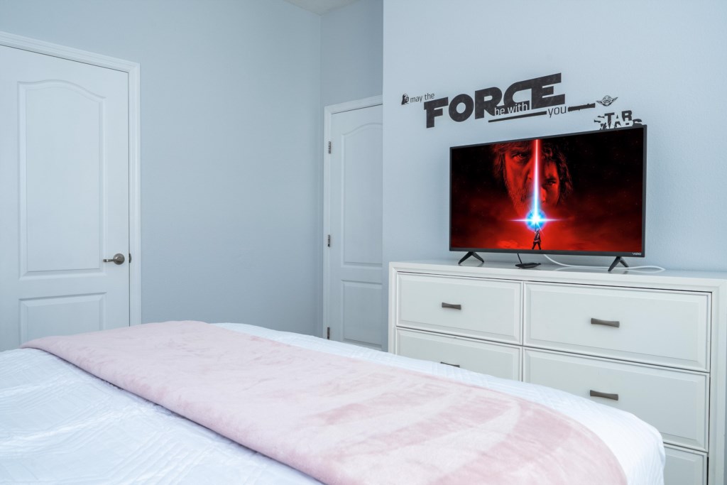 1st floor bedroom w/ queen bed and flat screen TV