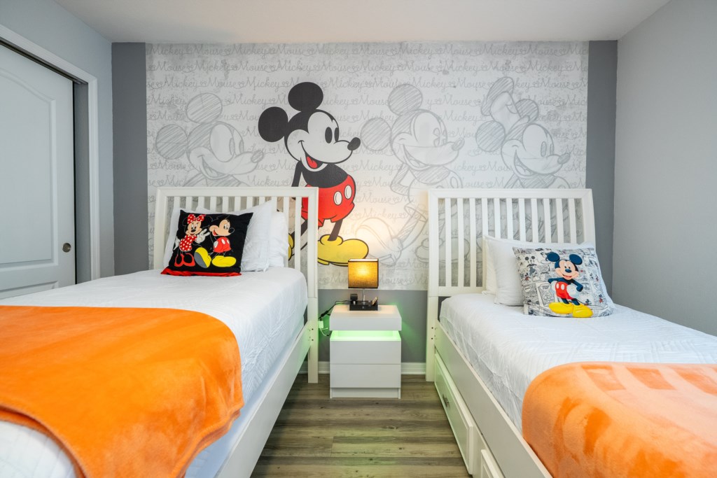 Mickey themed bedroom w/ 2 singles beds + flat screen TV