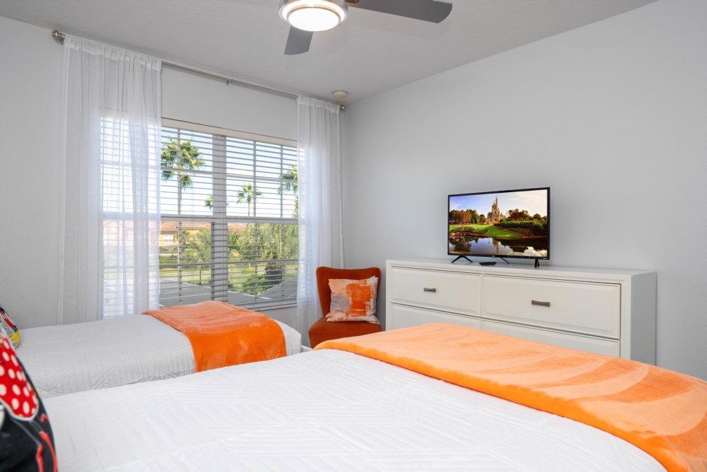 Mickey themed bedroom w/ 2 singles beds + flat screen TV