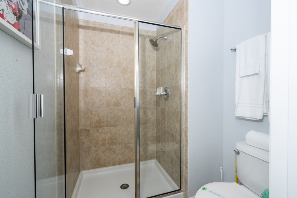 Shared bathroom w/ walk in shower and double sinks