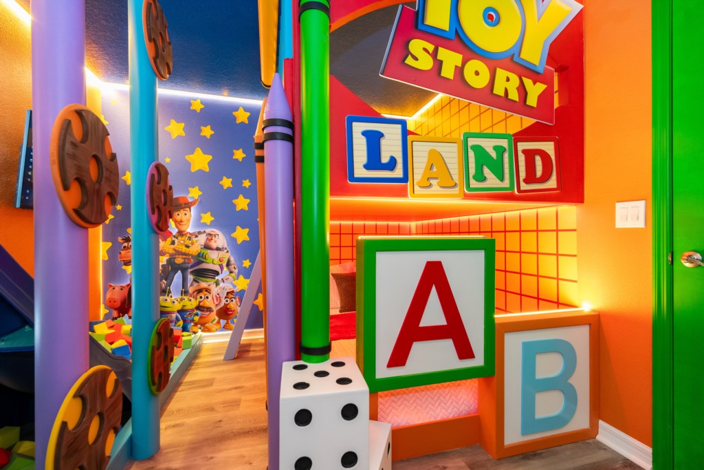 Toy Story Themed bedroom w/ 2 full beds and TV (hidden passage to the other themed bedroom).