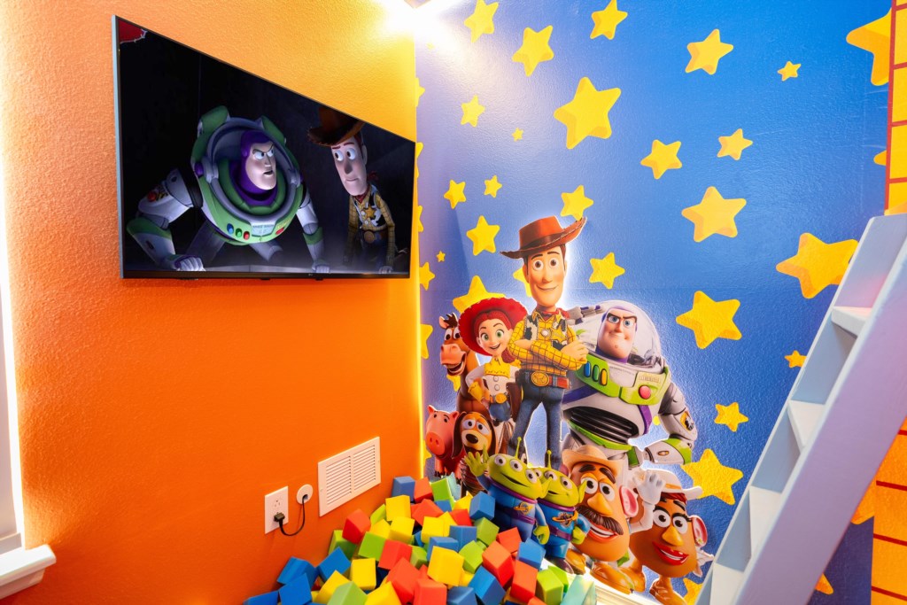 Toy Story Themed bedroom w/ 2 full beds and TV (hidden passage to the other themed bedroom).