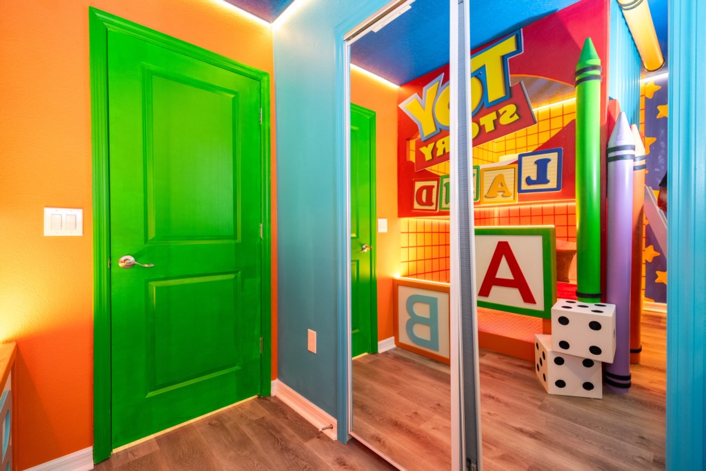 Toy Story Themed bedroom w/ 2 full beds and TV (hidden passage to the other themed bedroom).
