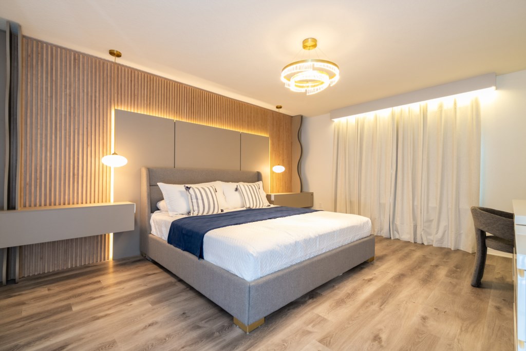 Master suite w/ king size bed, TV, work area and private bathroom