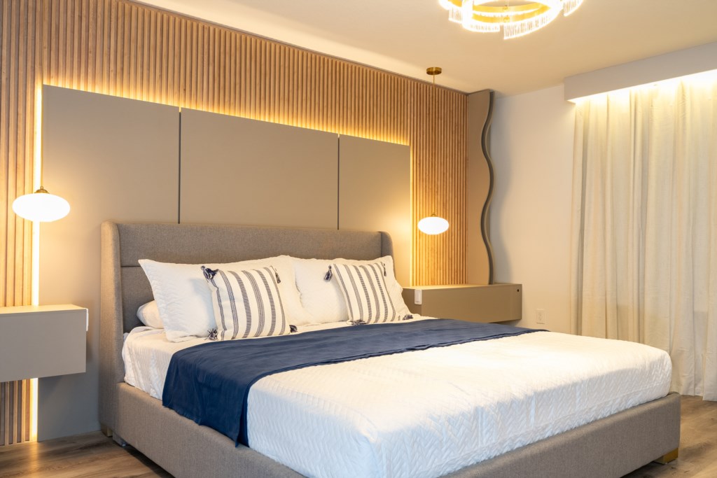 Master suite w/ king size bed, TV, work area and private bathroom