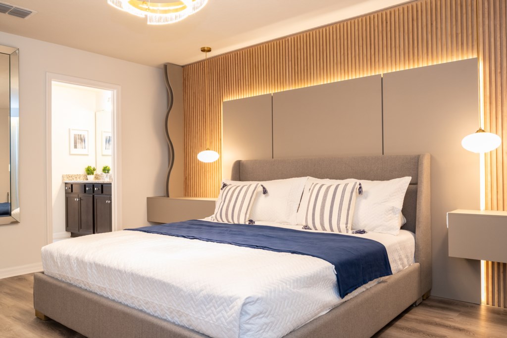 Master suite w/ king size bed, TV, work area and private bathroom