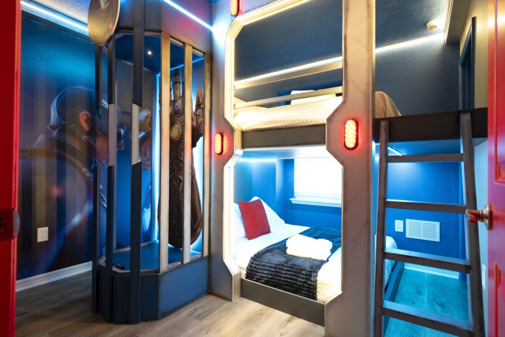 Avengers themed bedroom with 2 full beds and TV (hidden passage to the Toy Story Bedroom)