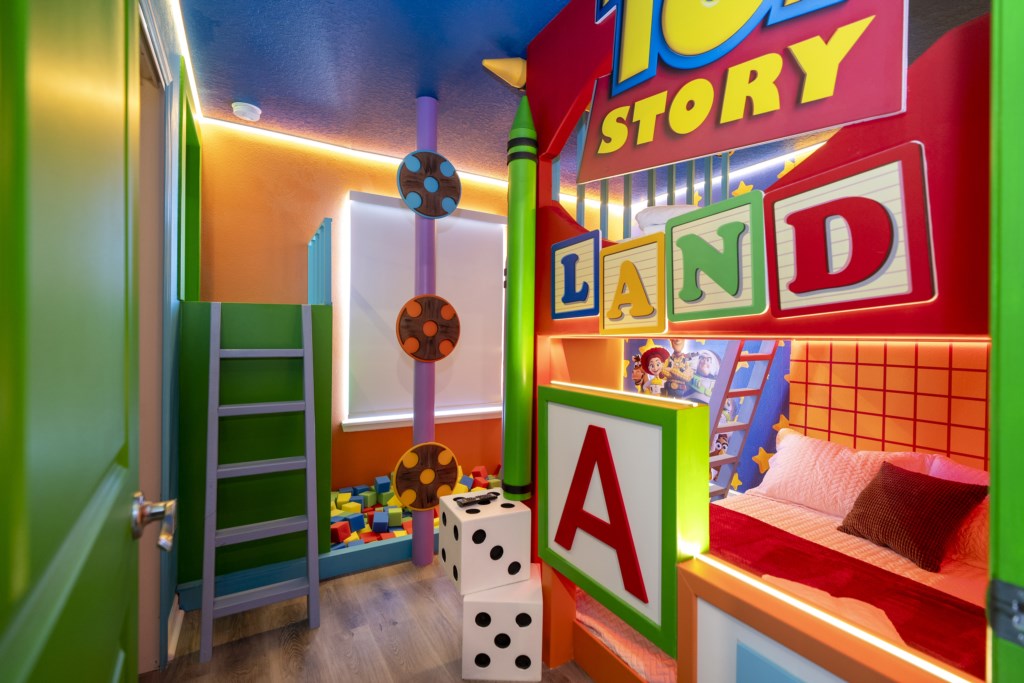 Toy Story Themed bedroom w/ 2 full beds and TV (hidden passage to the other themed bedroom).