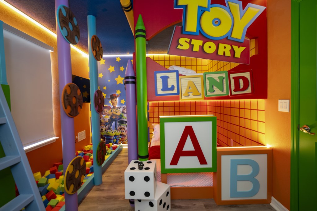 Toy Story Themed bedroom w/ 2 full beds and TV (hidden passage to the other themed bedroom).