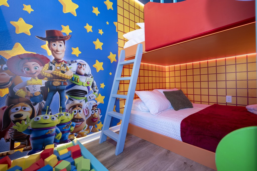 Toy Story Themed bedroom w/ 2 full beds and TV (hidden passage to the other themed bedroom).