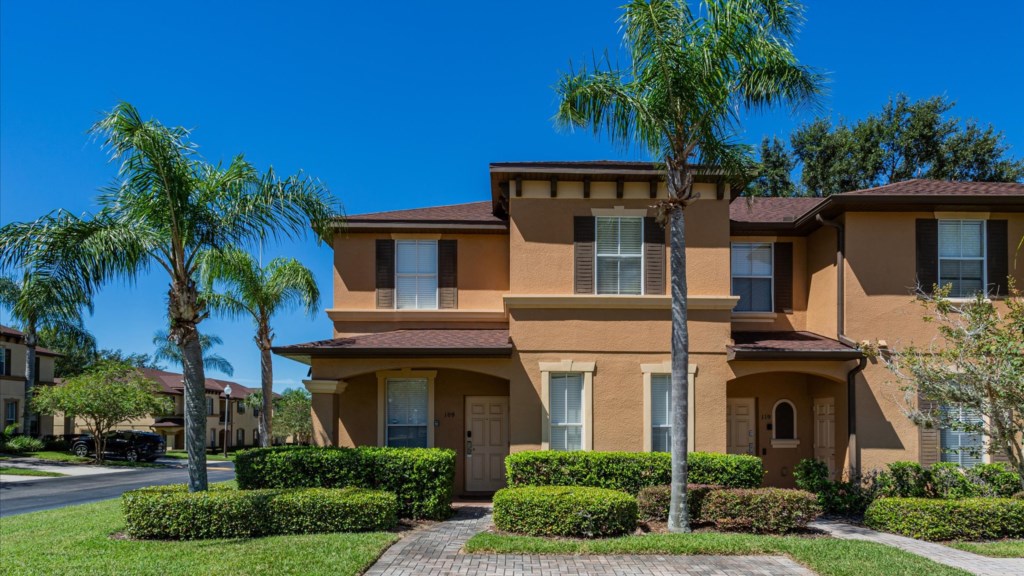 Exterior Front View
Beautiful corner townhome with tropical landscaping and private front entrance.