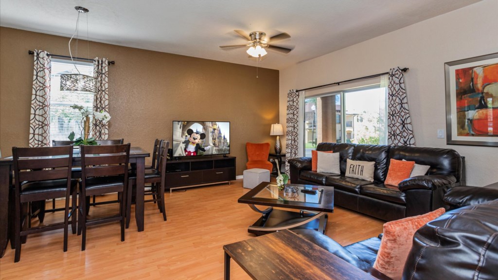 Living Room & Dining Area
Open-plan living and dining area with a large family dining table and cozy lounge seating.