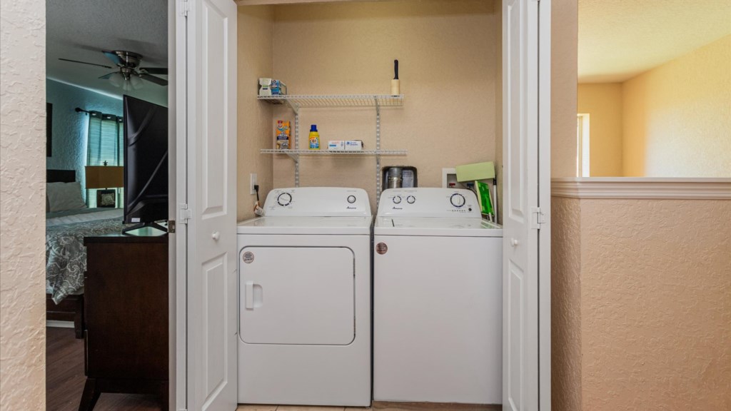 Laundry Area
Convenient in-home laundry with washer and dryer, plus shelving stocked with essentials.