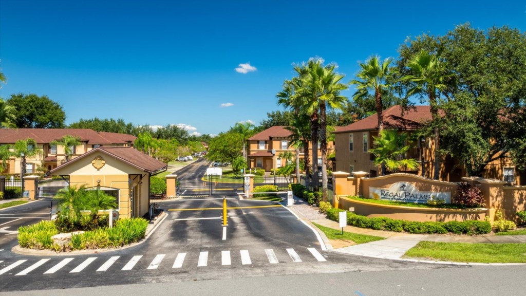 A secure gated entrance welcomes you to Regal Palms Resort, lined with palm trees and beautifully landscaped grounds for