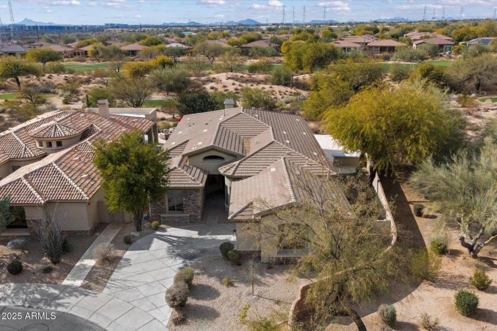 Spacious desert retreat with scenic views and golf course access.