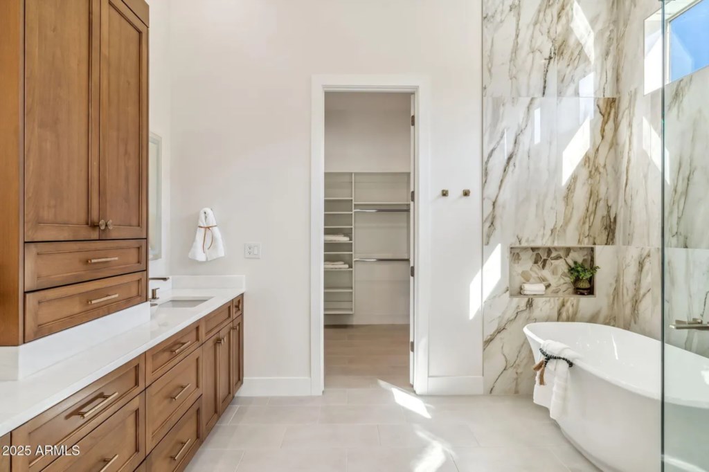 Luxurious bathroom with marble accents and a freestanding tub for ultimate relaxation.