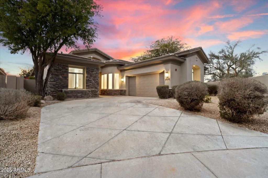 Charming home with stunning sunset views and a spacious driveway.