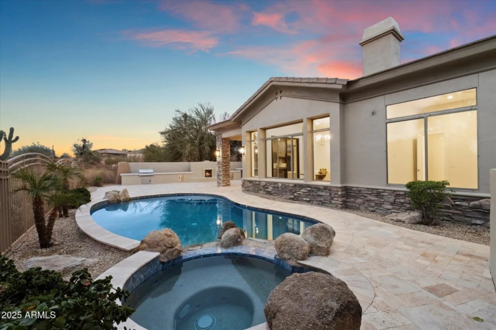 Private pool with hot tub and desert views, perfect for sunset relaxation.
