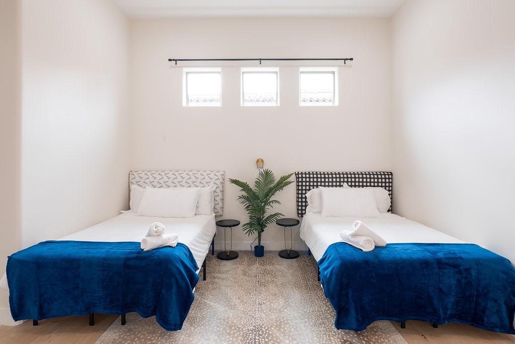 Bedroom 4 is two full beds with walk in shower