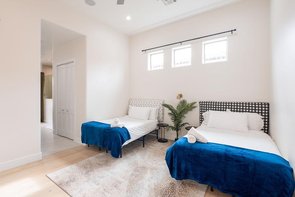 Bedroom 4 is two full beds with walk in shower