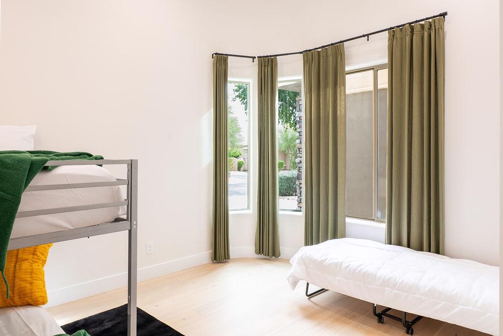 Bedroom 2 is two full beds and twin rolling trundle