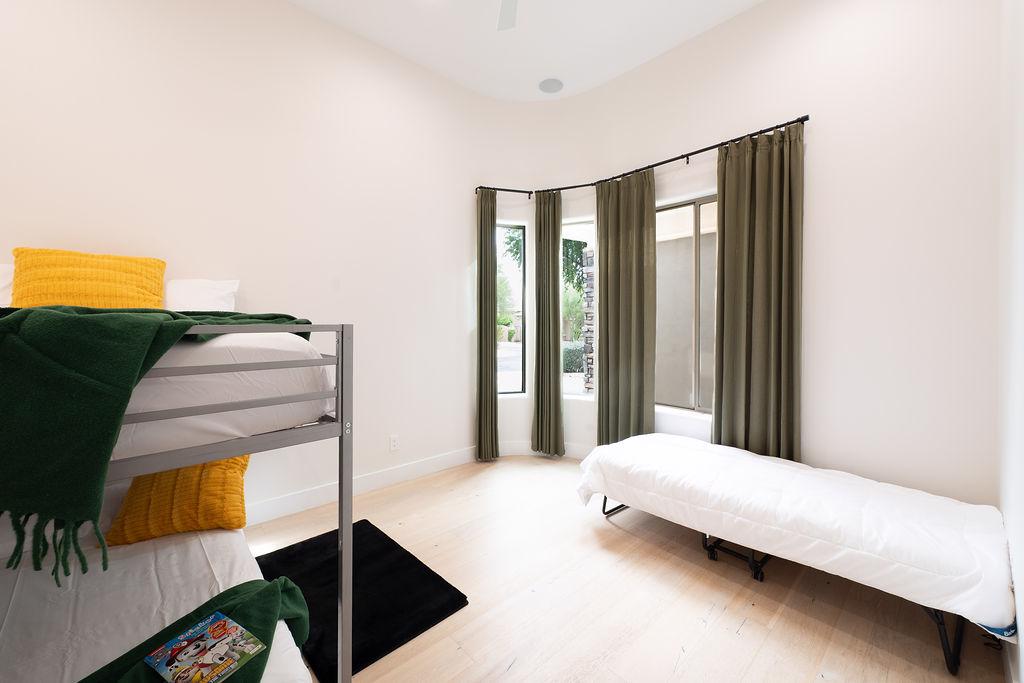 Bedroom 2 is two full beds and twin rolling trundle