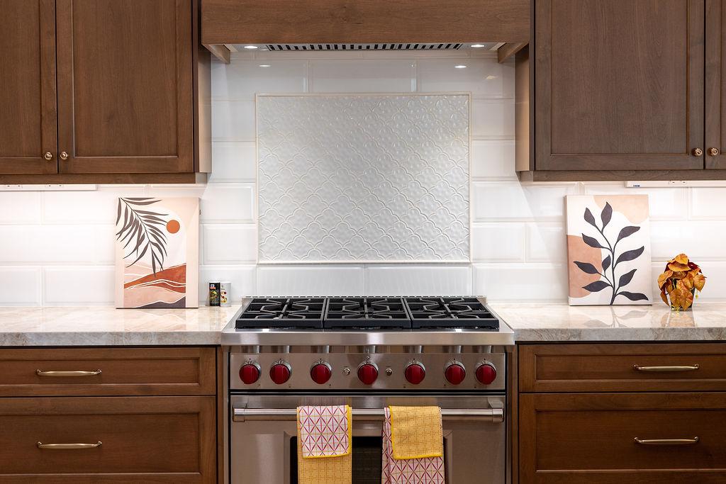 Modern kitchen with high-end appliances and elegant marble countertops.