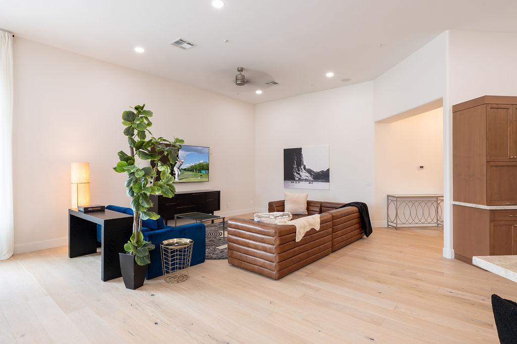 Open-concept living room flooded with natural light | Smart TV