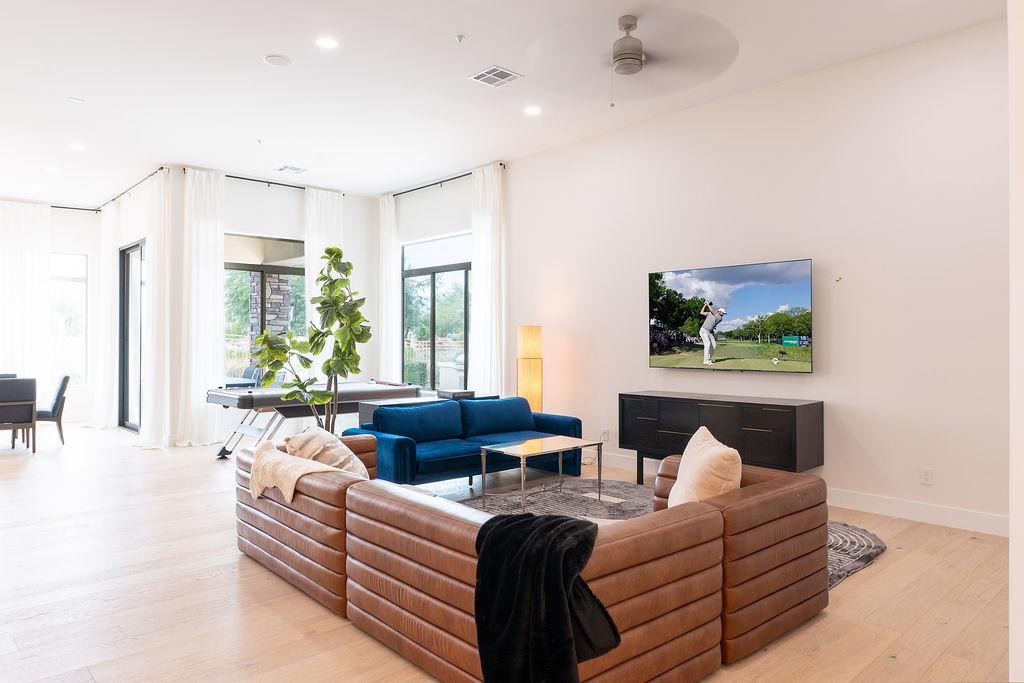 Open-concept living room flooded with natural light | Smart TV