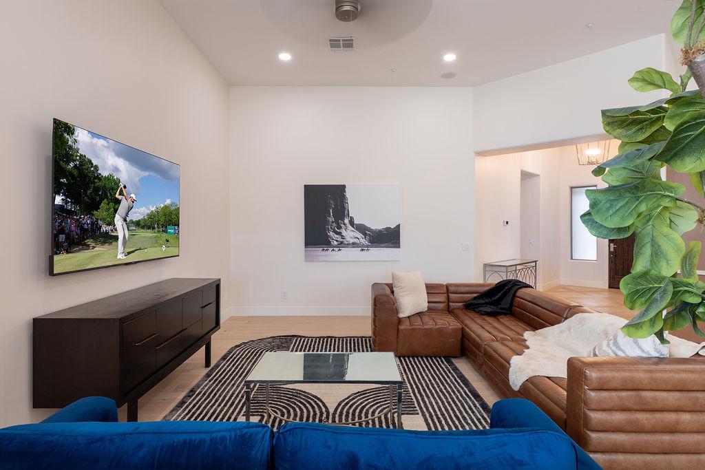 Open-concept living room flooded with natural light | Smart TV