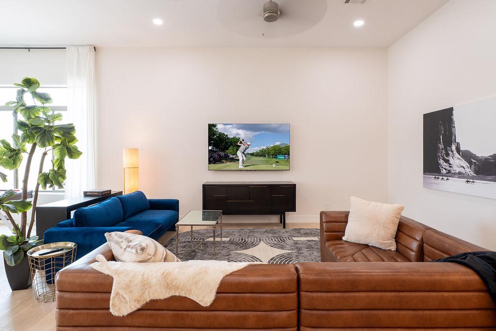 Open-concept living room flooded with natural light | Smart TV