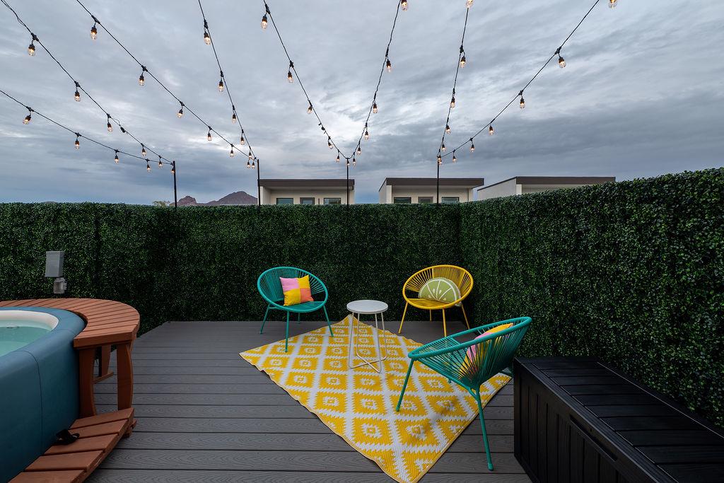 Rooftop hot tub, lounge seating, and BBQ grill