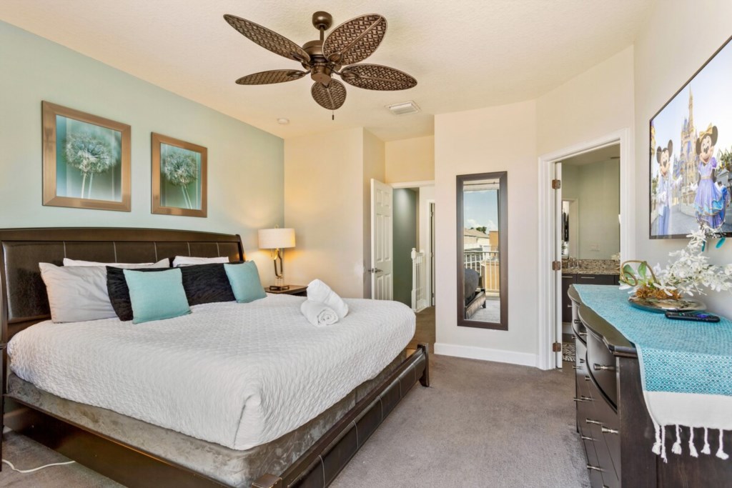 Master Bedroom: Features a King bed and comfortably sleeps 2 guests.