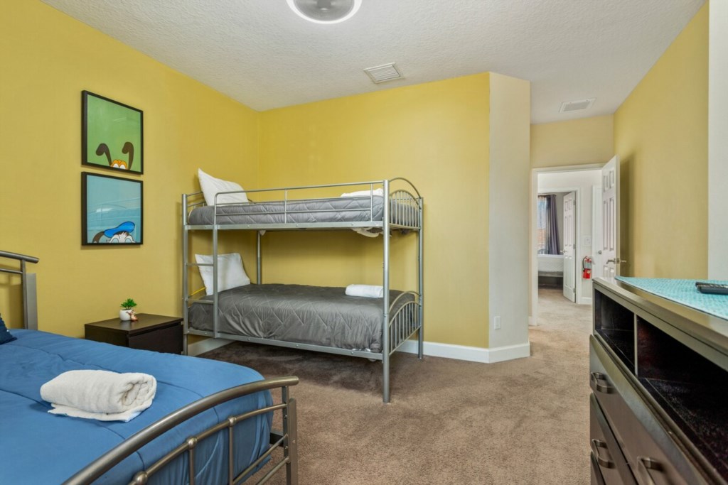Kids' Bedroom: Features one twin bed and one bunk bed, designed for fun and comfort.